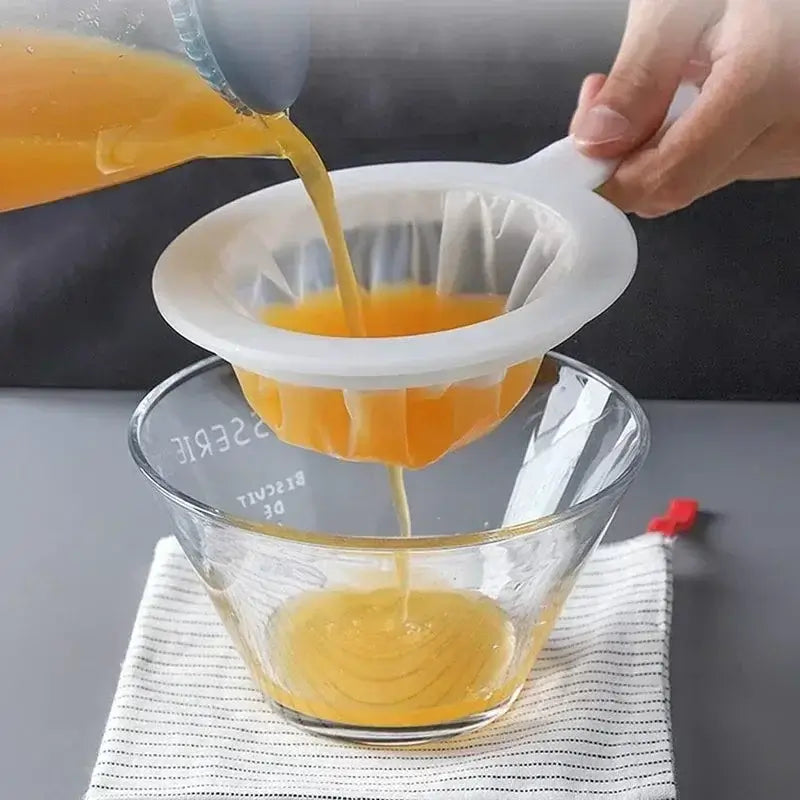 Ultra Fine Nylon Filter Mesh Strainer pouring juice into a glass bowl, showcasing its effective colander design.