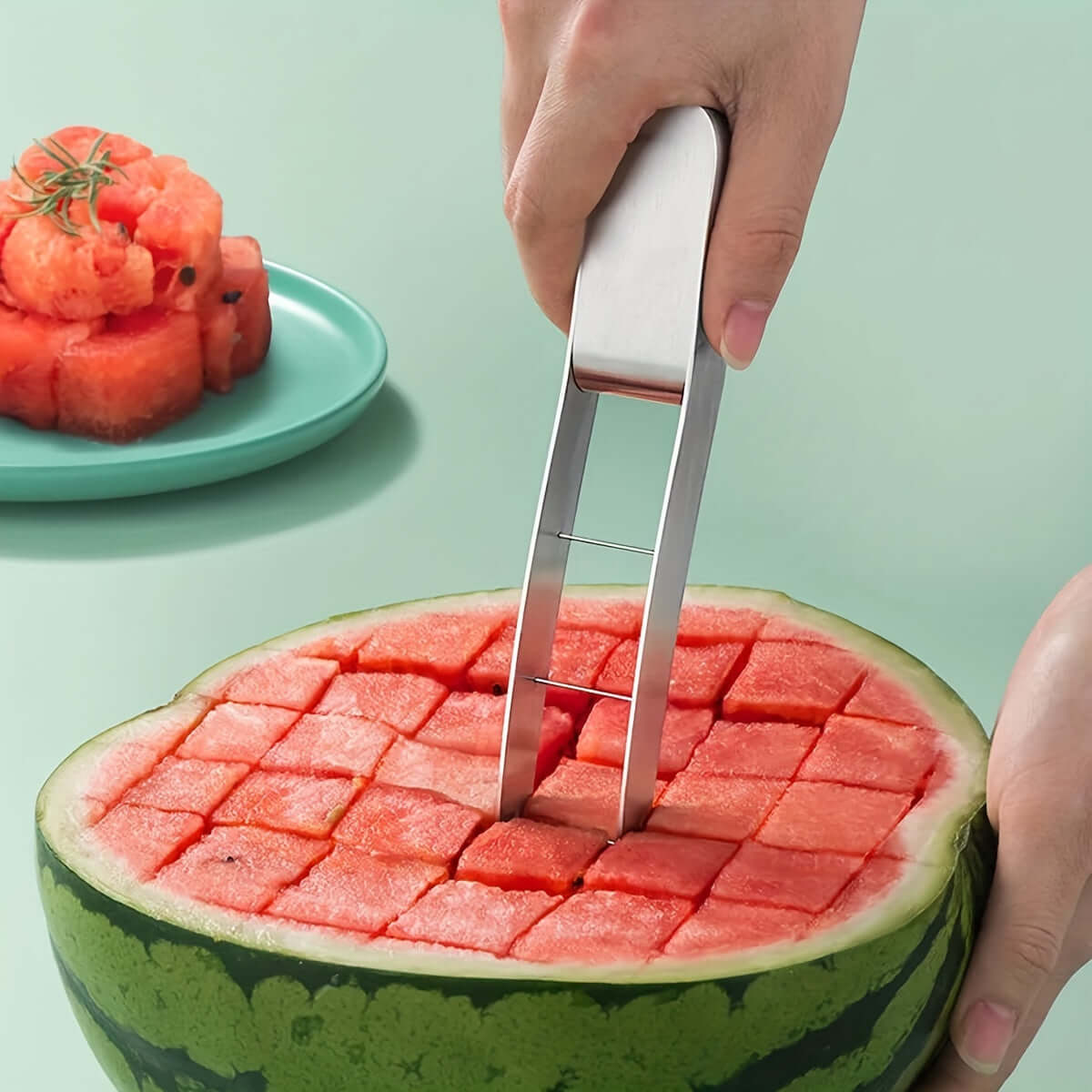 304 stainless steel watermelon slicer creating perfect cubes from a watermelon, showcasing easy fruit preparation.