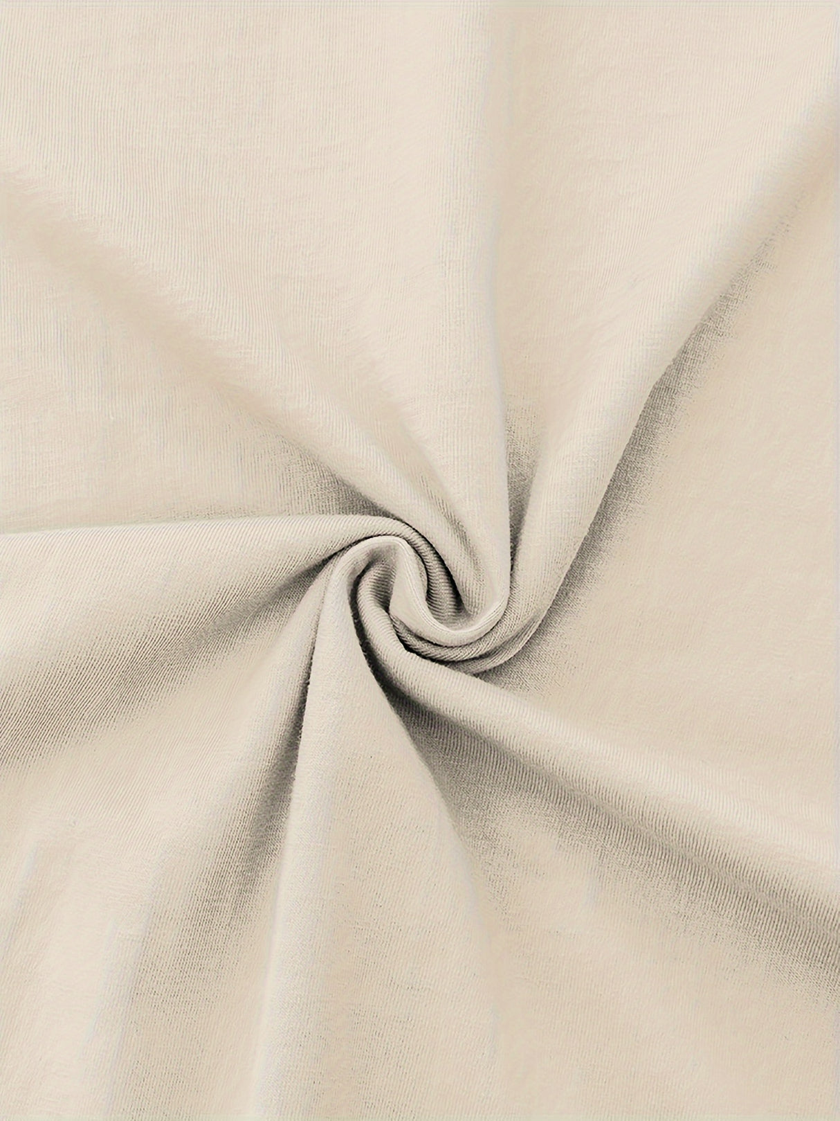 Close-up of soft beige cotton fabric, showcasing smooth texture and micro elasticity, ideal for casual clothing.