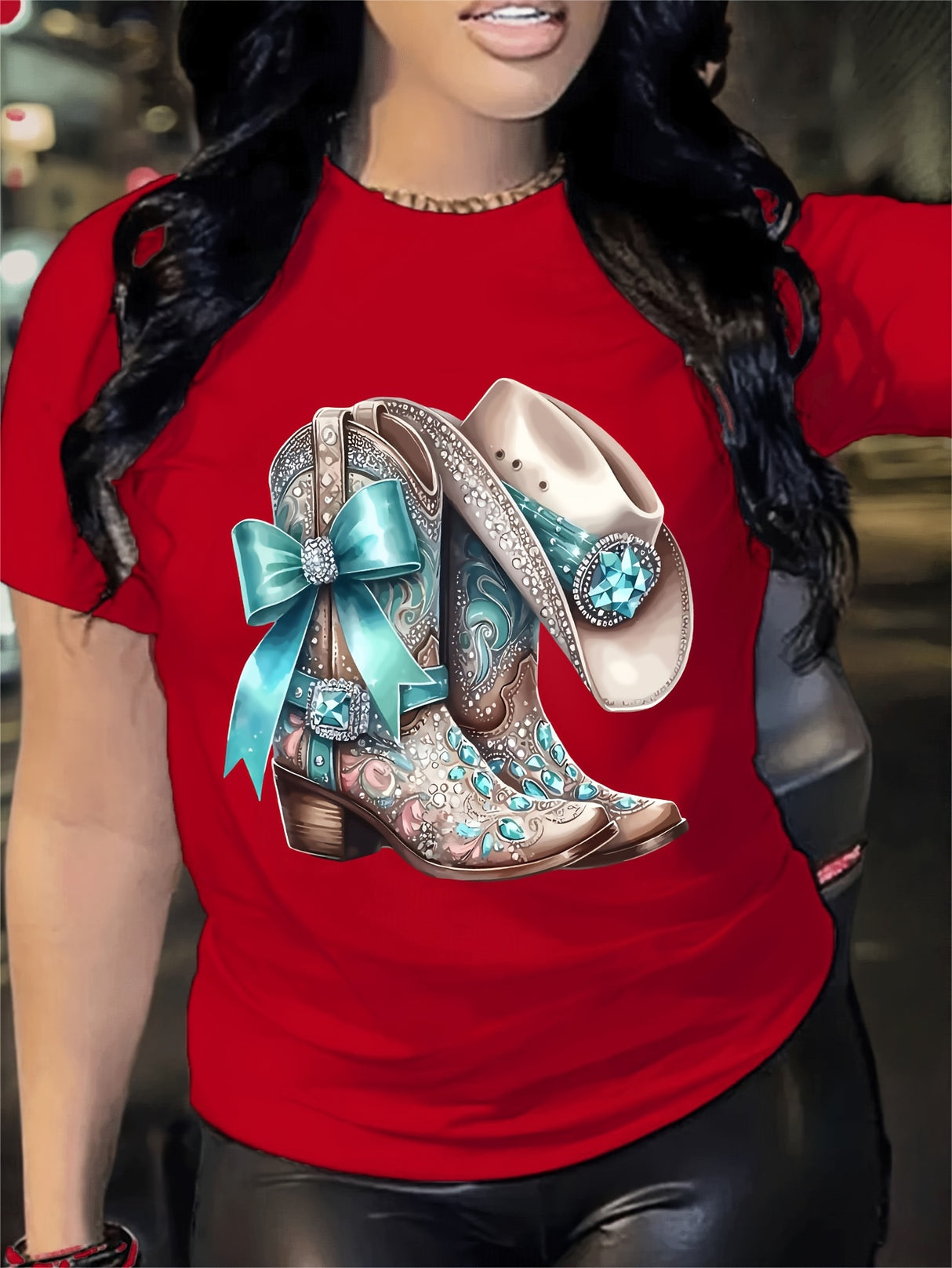 Red t-shirt with a vibrant graphic of embellished cowboy boots and a bow, perfect for casual wear.