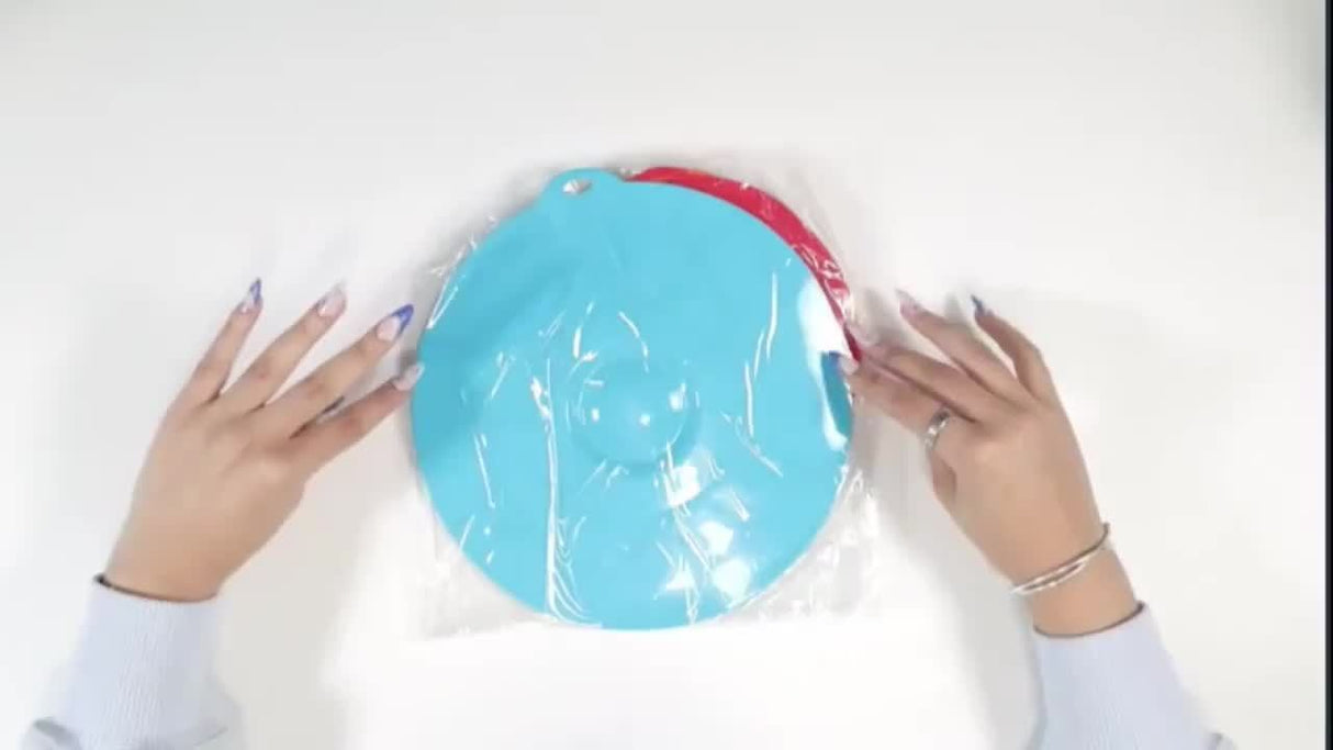 Two silicone bowl lids in blue and red packaging, showcasing heat-resistant features and versatile sizes.