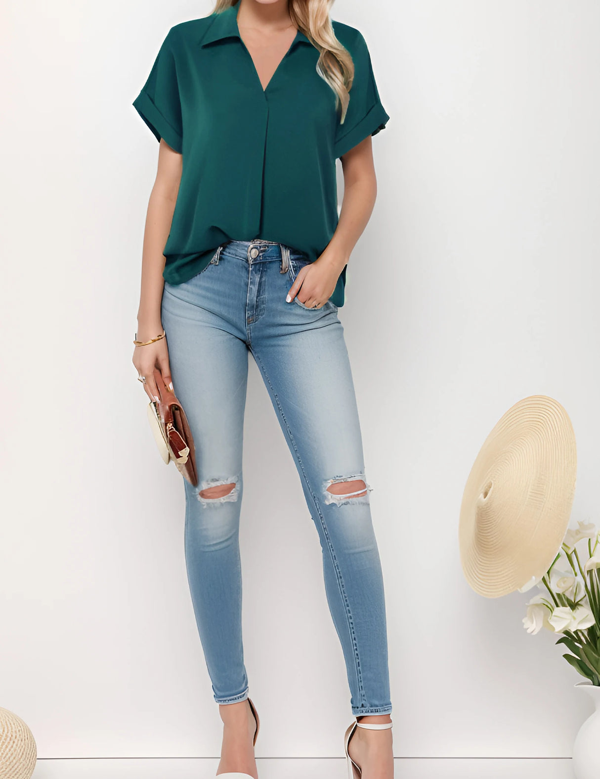 Model wearing a teal Chiffon shirt with short sleeves and ripped skinny jeans, showcasing casual office wear style.