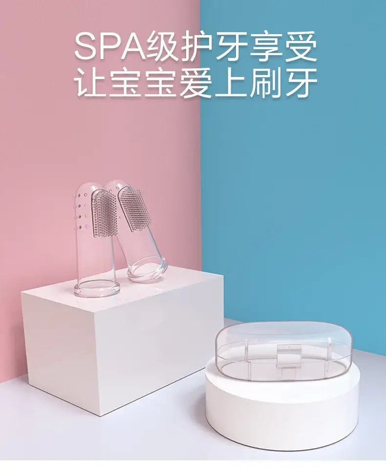 Transparent baby toothbrushes on display, featuring a modern design against a pastel background.