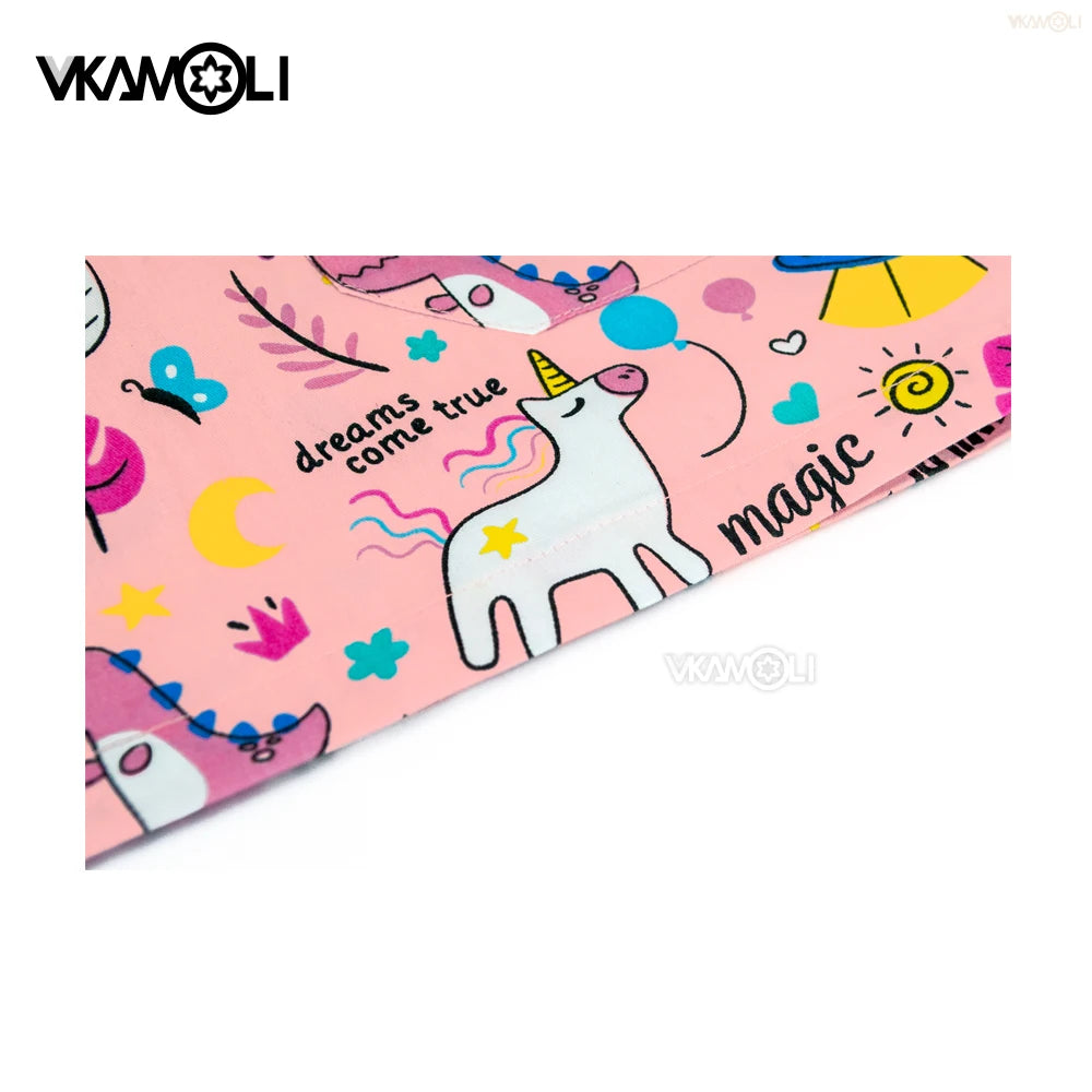 Cartoon print scrub top featuring unicorns and colorful designs, perfect for medical professionals and available in various sizes.