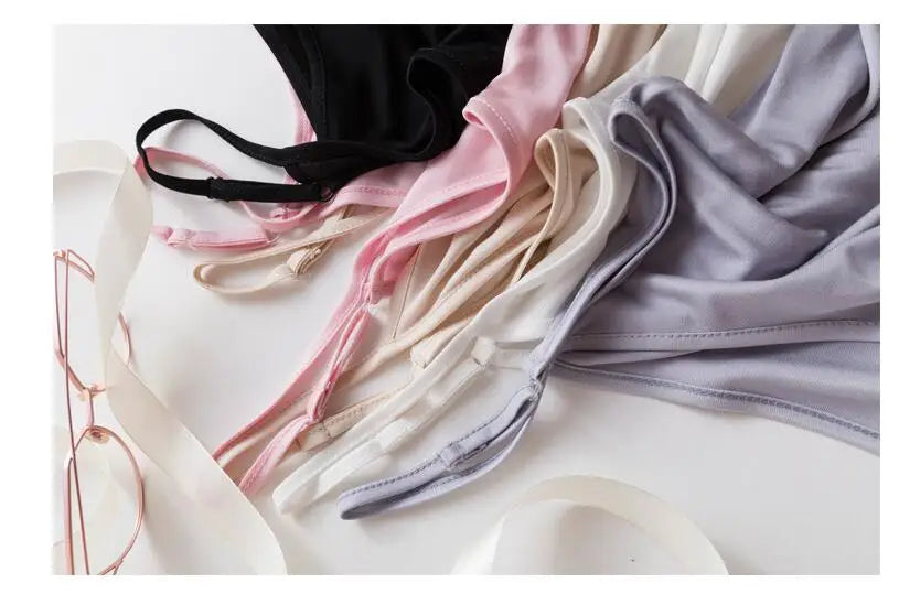 Colorful collection of HalterSilk™ U-Neck Mulberry Silk camisoles with solid straps, perfect for lightweight summer wear.