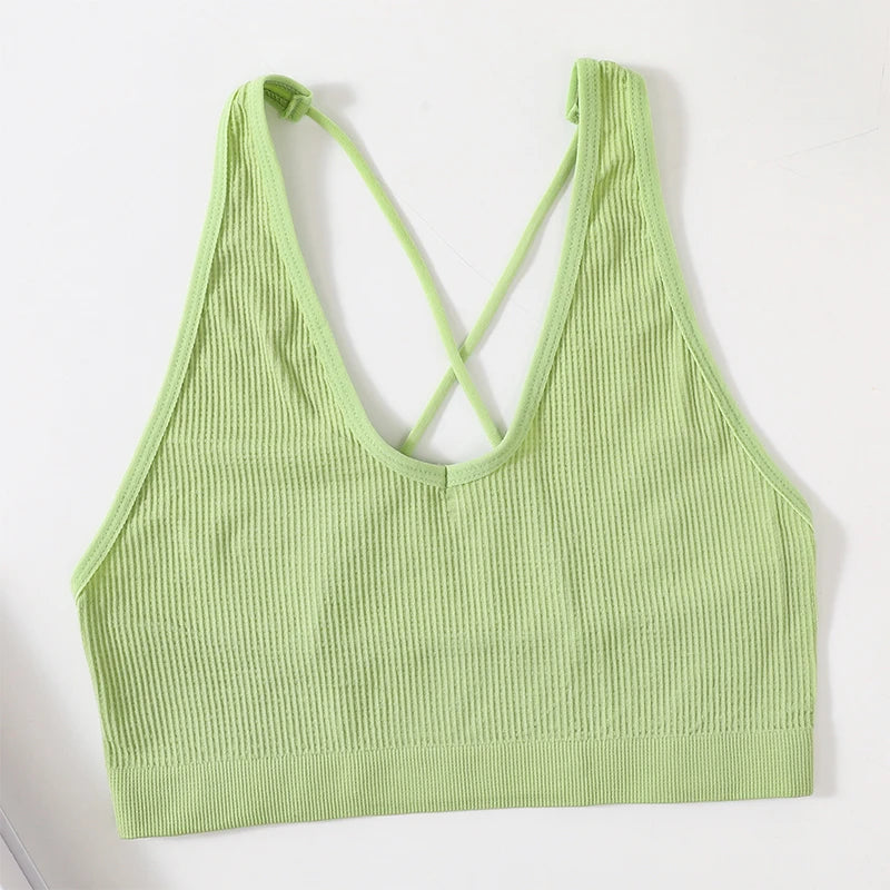 MonoSculpt™ green seamless crop top with crisscross back for women, perfect for streetwear-inspired outfits.