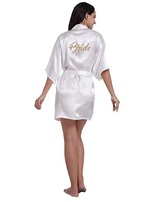 Elegant satin bridal robe with golden lettering, perfect for wedding day preparations.