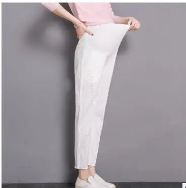 Women wearing casual 3-color maternity pants in white, showcasing comfort and style for summer trousers.