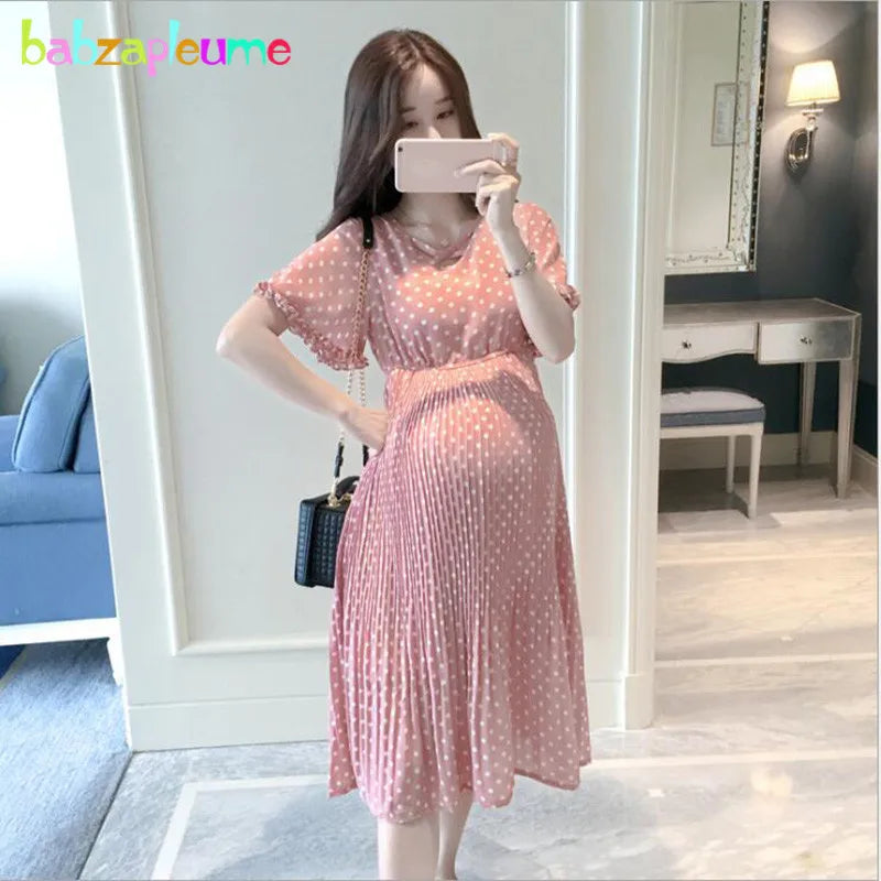 Chiffon polka dot maternity dress in pink, knee-length, casual style, perfect for summer, featuring breastfeeding function.