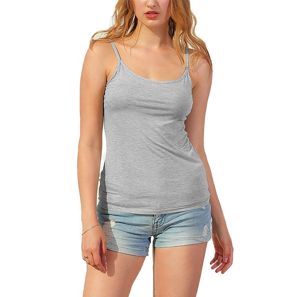 Model wearing a light gray camisole tank top with adjustable straps and casual denim shorts.