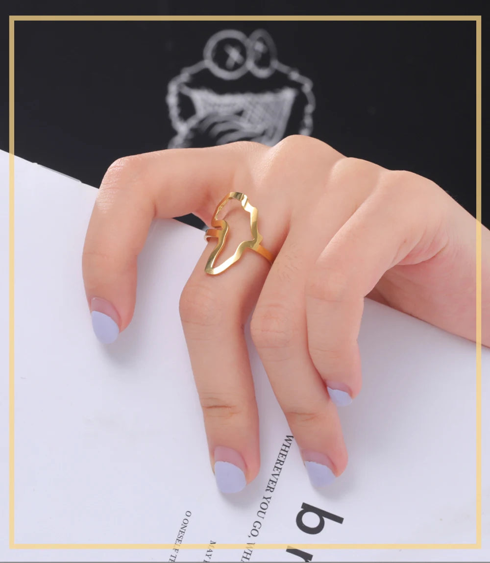 Gold African map ring on a woman's finger, showcasing stylish women's jewelry for daily wear.