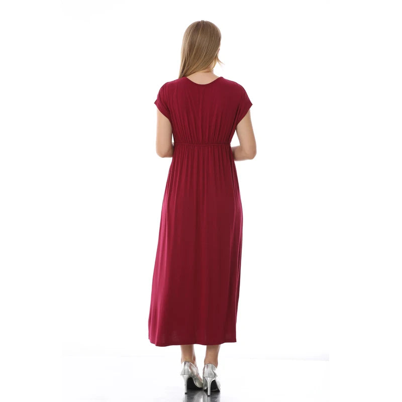 Back view of a soft fabric maternity dress in burgundy, featuring a V-neck and mid-calf length design.