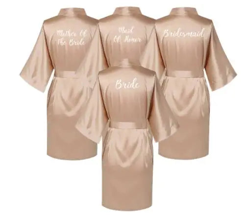 Rose gold satin bridal robes for bride, bridesmaid, maid of honor, and mother of the bride.