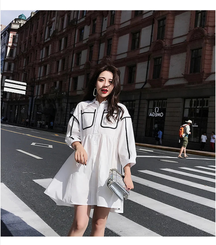 Maternity shirt dress in solid white color, featuring turn-down collar and pockets, ideal for summer outings or beach parties.