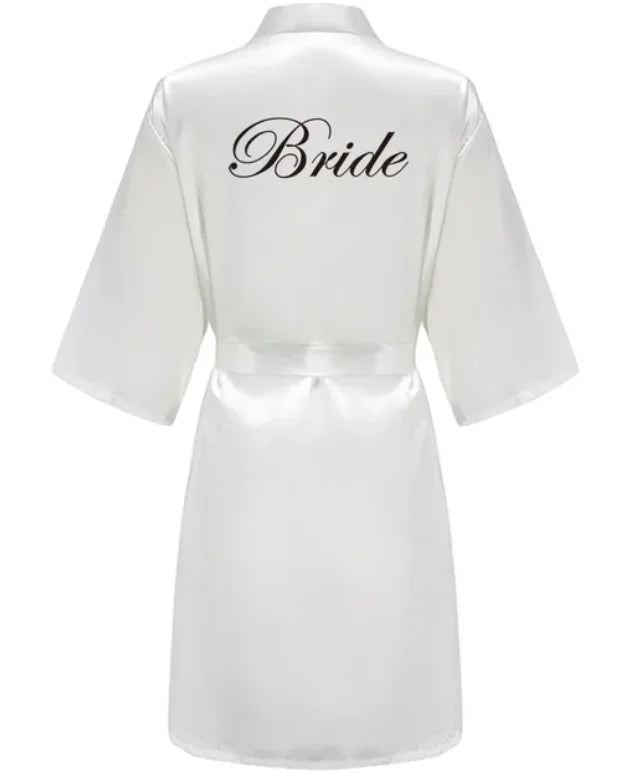 Team Bride satin robe in white with stylish 'Bride' lettering on the back, ideal for wedding celebrations.