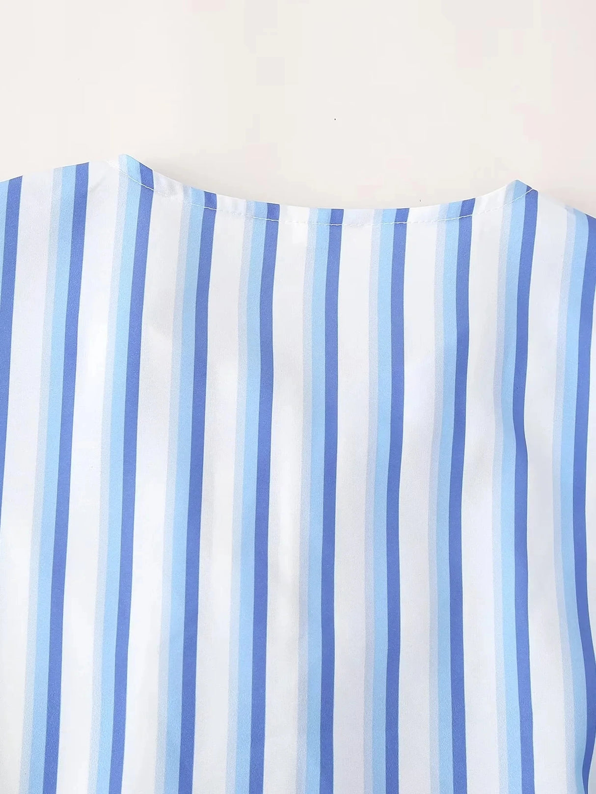BowChic™ Stripe Lace-Up Blouse featuring a blue and white striped pattern with a stylish O-neck collar.