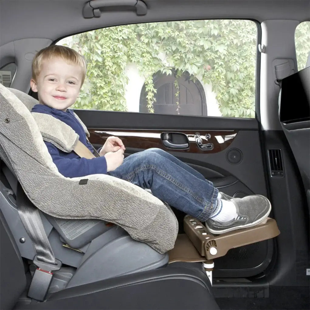 Child enjoying a safe ride in an adjustable and foldable car safety seat, showcasing comfort and security for kids.