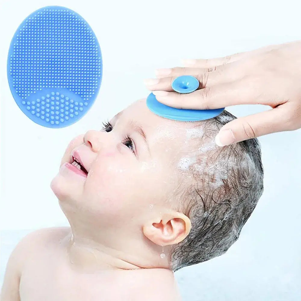 Baby silicone bath brush being used on a newborn during bath time for gentle cleaning and hair care.