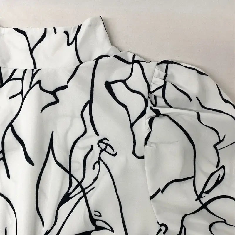 جمبسوت نسائي واسع الساق بطبعة فنية