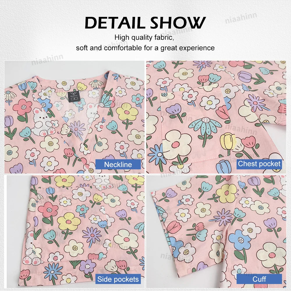 Detail view of cartoon print dental scrubs featuring floral design, V-neckline, chest pocket, and side pockets.
