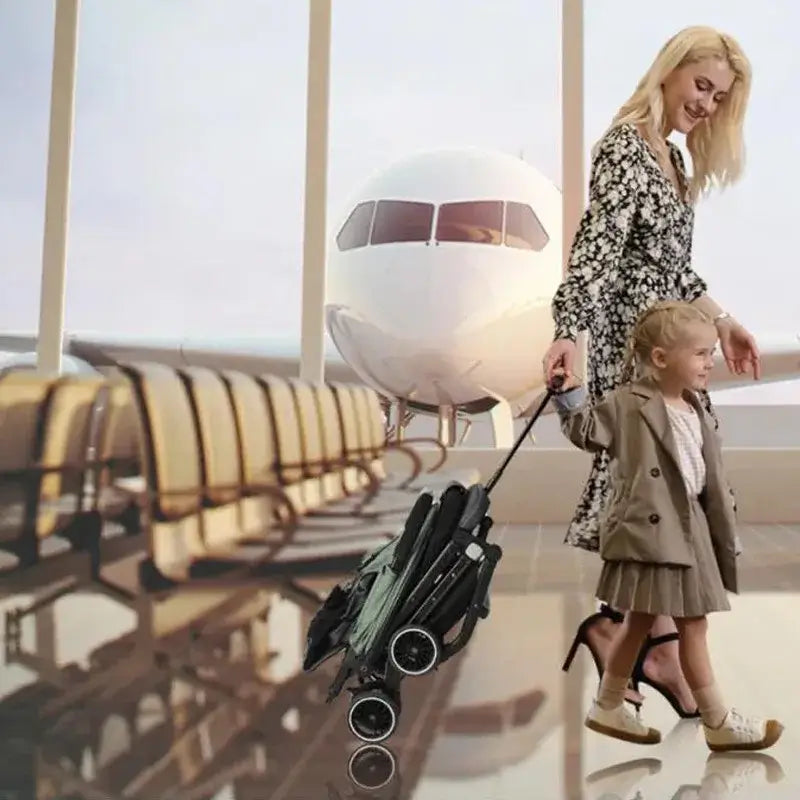 A mother and child happily walking with a portable foldable baby stroller at an airport terminal.