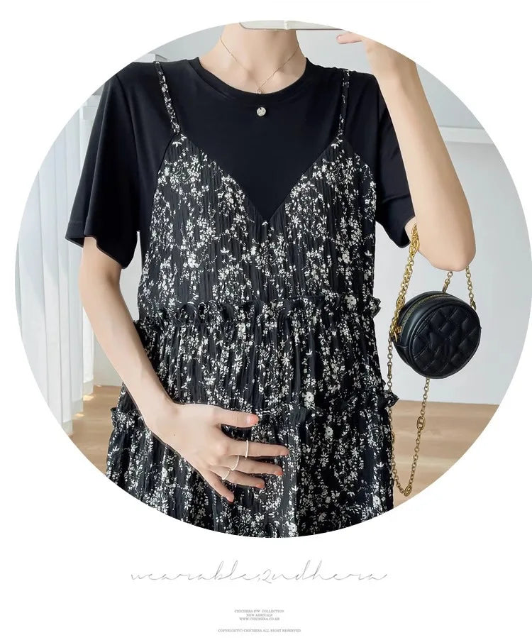 Elegant black floral maternity dress with spaghetti straps, perfect for baby showers and summer outings.