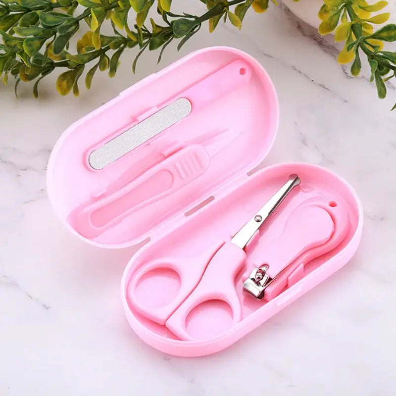Baby children's nail clipper kit in a pink case, includes clippers, scissors, and nail file, perfect for gentle grooming.