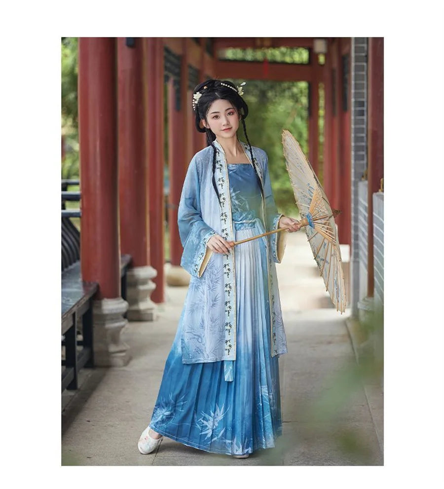 Women's Hanfu cosplay in blue and white traditional dress, holding a parasol outdoors.