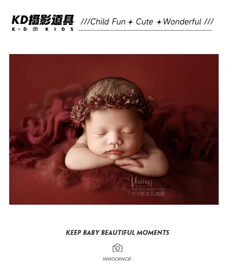 Newborn girl wearing a faux flower headband during photography session, showcasing adorable and peaceful expression.