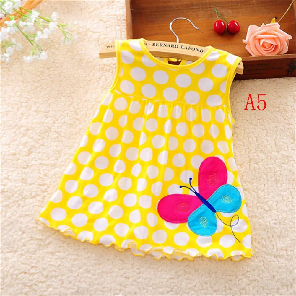 Yellow polka dot dress for baby girls with butterfly design, perfect summer outfit for newborns and toddlers.