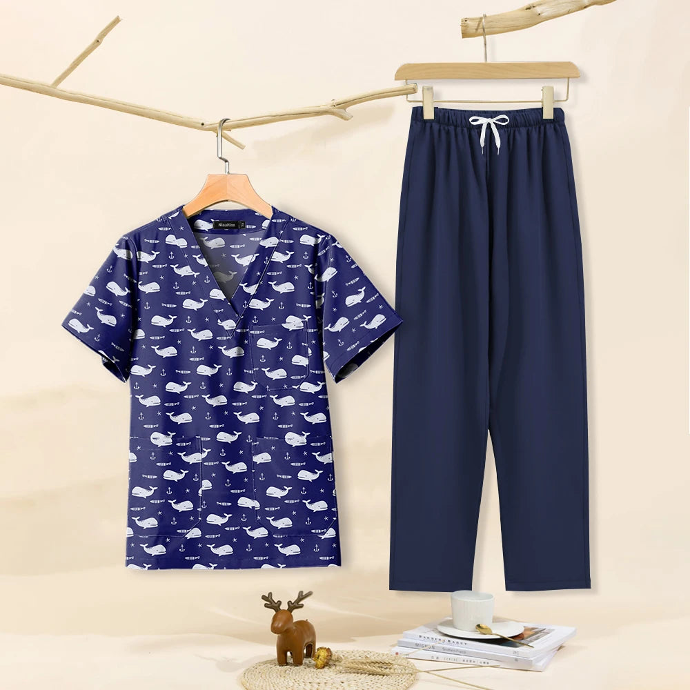 Cartoon print dental scrubs for women, featuring a whale design top and navy pants, perfect for pet grooming workwear.