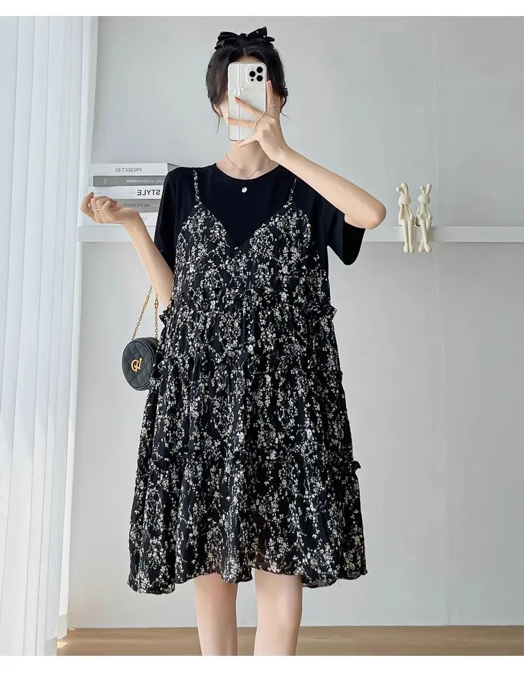 Elegant black floral knee-length maternity dress with layered design, perfect for summer baby showers.