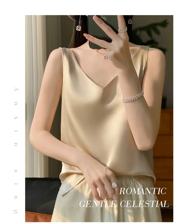 Woman wearing a silk v-neck camisole top in beige, showcasing a romantic and gentle style.
