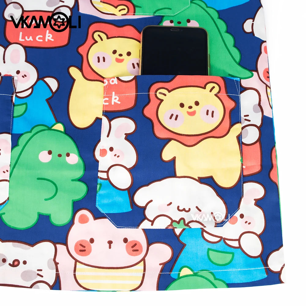 Colorful cartoon scrub top with pockets featuring playful animal designs and a smartphone, perfect for medical professionals.