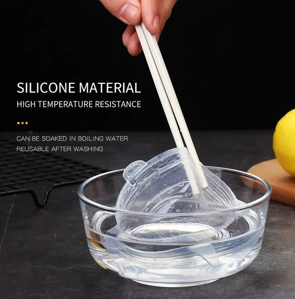 Silicone stretch lid being lifted from a bowl, showcasing high temperature resistance and easy cleaning.