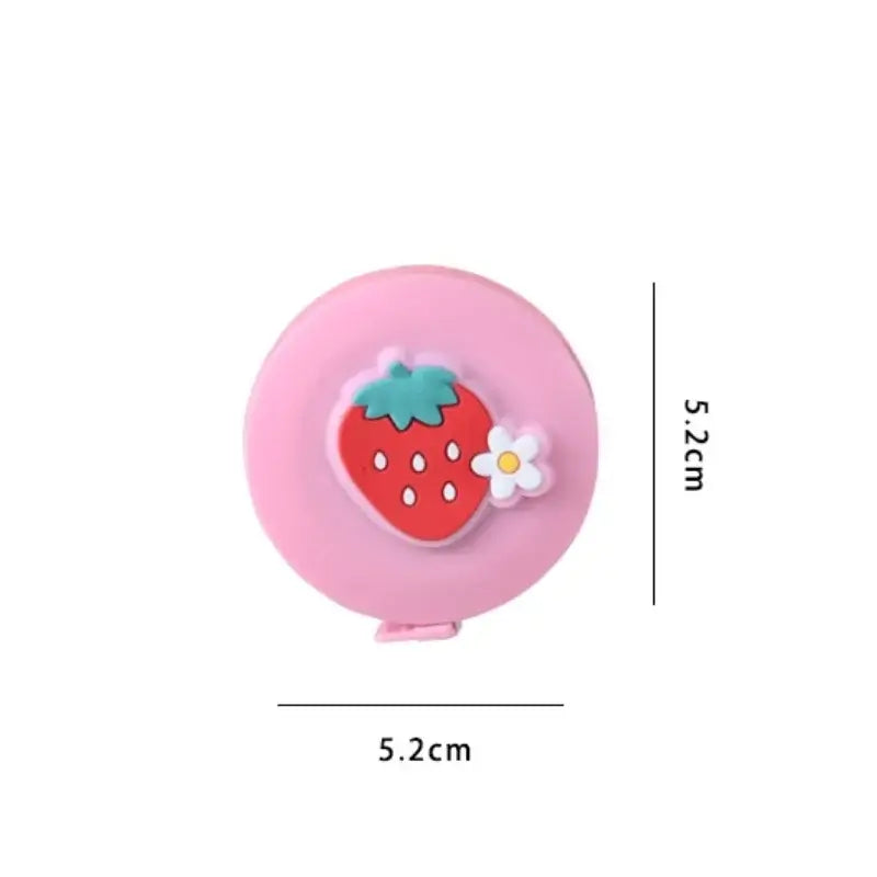 Cute pink measuring tape with a strawberry design, compact size 5.2cm, perfect for kids and trendy accessories.