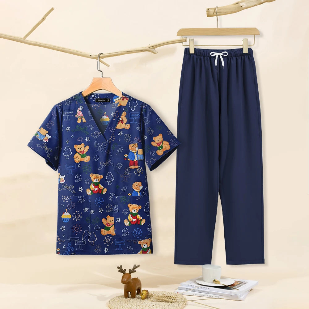 Cartoon print dental scrubs set for women, featuring V-neck top and pants, ideal for pet grooming and beauty salons.