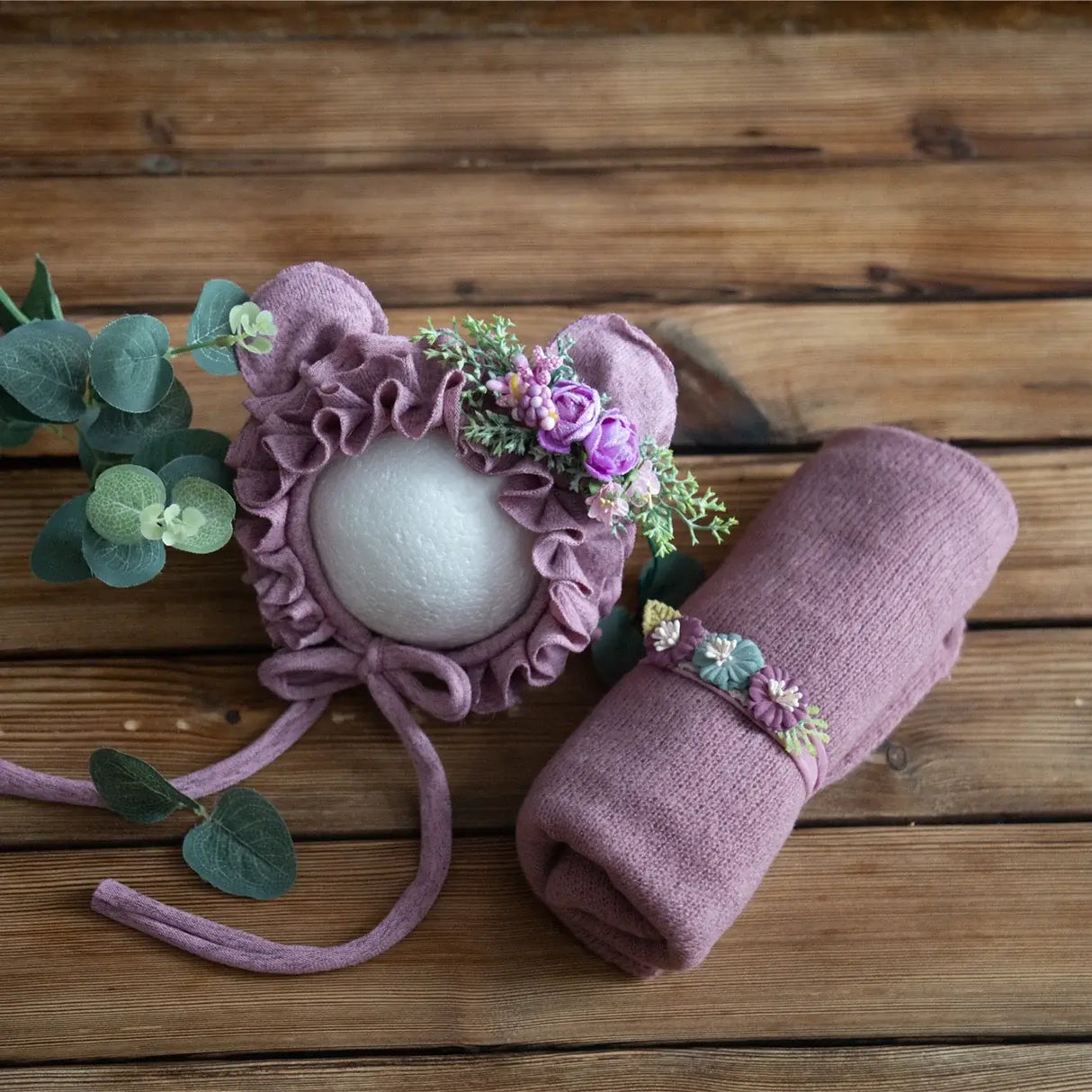 Newborn stretch knit mohair hat with floral adornments and matching wrap, perfect for baby photography sessions.