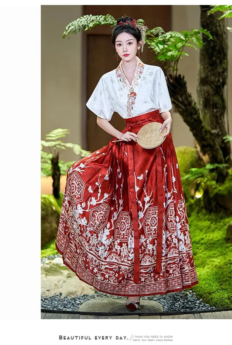 Traditional Hanfu oversized embroidered blouse with red skirt, showcasing elegant design in a serene garden setting.