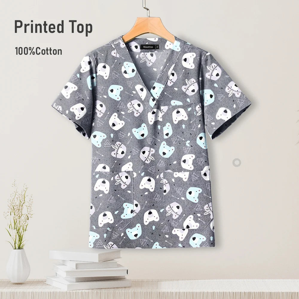 Gray cotton pediatric surgical scrub top with playful animal print, perfect for nursing uniforms.