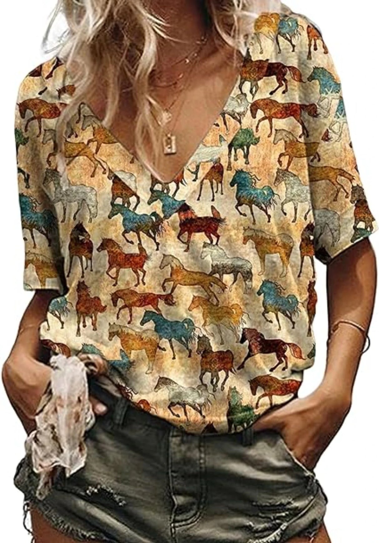 Women wearing a Western cowgirl graphic t-shirt featuring a colorful horse pattern and a v-neck design.