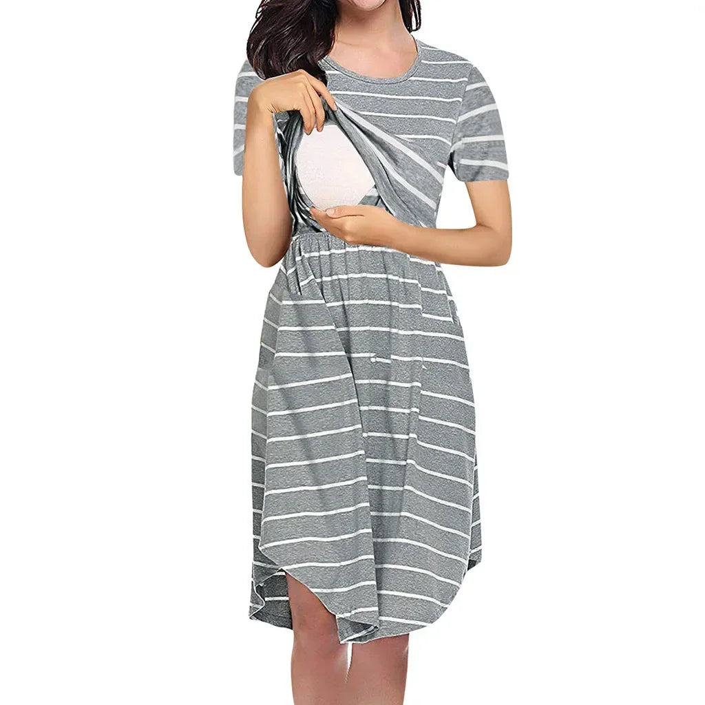 Woman in striped multifunctional nursing dress, showcasing easy breastfeeding access, ideal for maternity wear.