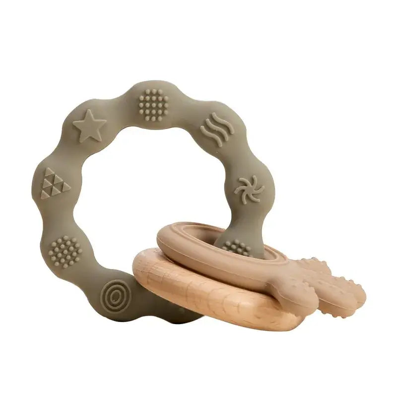 Silicone baby teether and wooden ring set designed for soothing infant gums and promoting sensory exploration.