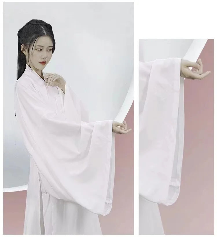 Elegant woman wearing a Ming Dynasty Hanfu inner robe costume with flowing sleeves, showcasing traditional Chinese fashion.