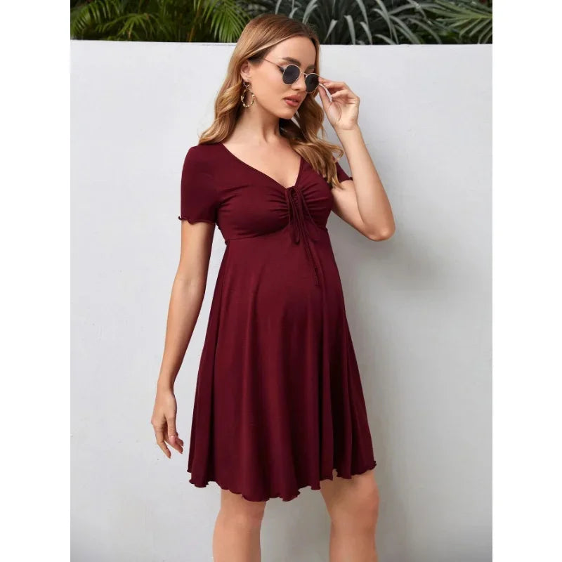 Pure color v-neck maternity dress in burgundy, knee-length, perfect for summer, designed for plus-size women.
