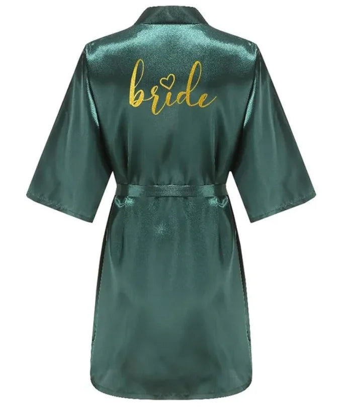 Back view of a green satin kimono robe with gold 'bride' lettering, perfect for bridal parties.