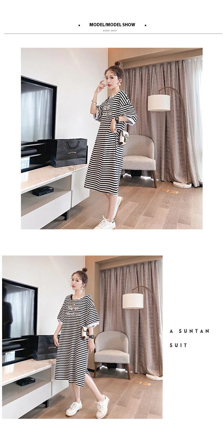 Model showcasing a striped maternity dress in a stylish interior, perfect for summer wear.