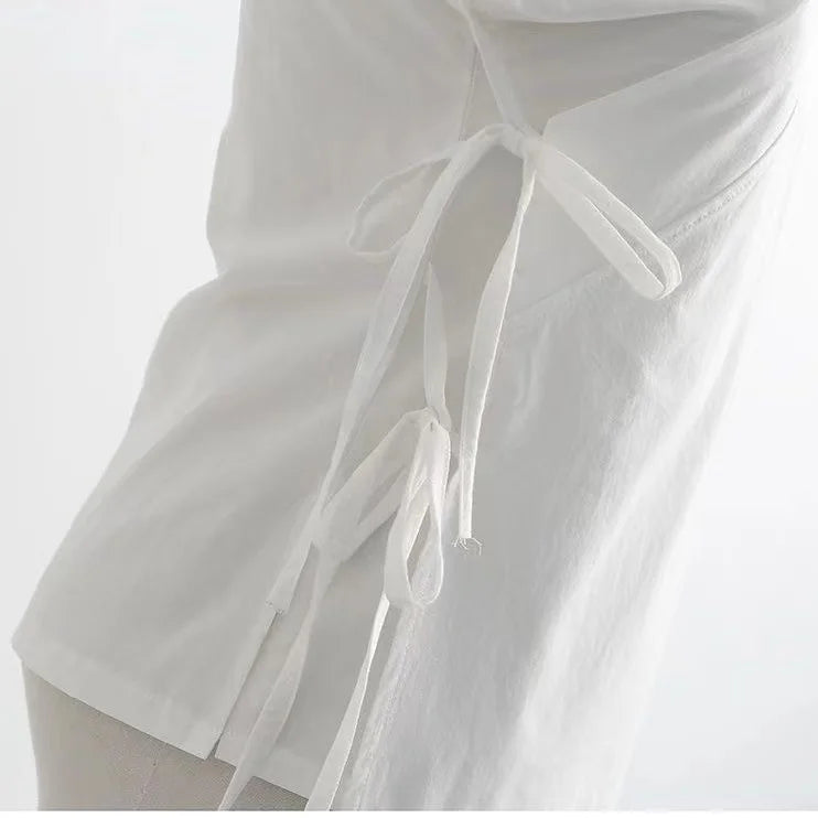 Close-up of a white traditional Hanfu inner robe showing tie details, made from polyester for men and women.