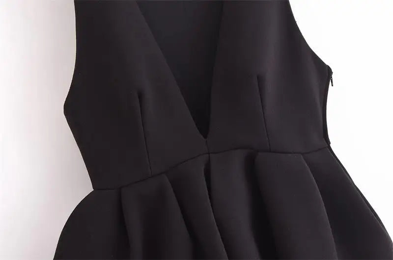 Elegant black V-neck tank top for women, perfect for party wear and casual outings, featuring a structured fit.