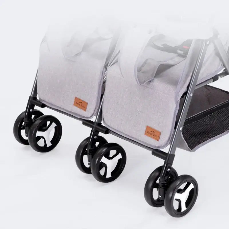 2025 New Twin Baby Stroller featuring dual seats, grey fabric, and sturdy wheels for easy maneuverability.